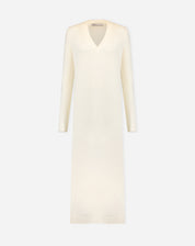 Close-up of the V-neck of off-white knit dress highlighting fabric texture, rib finish, and soft touch