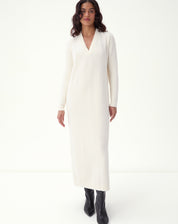 Midi dress in off-white knit front view in studio: model with V-neckline, long sleeves, and straight fit, minimalist look with black boots - off-white midi knit dress