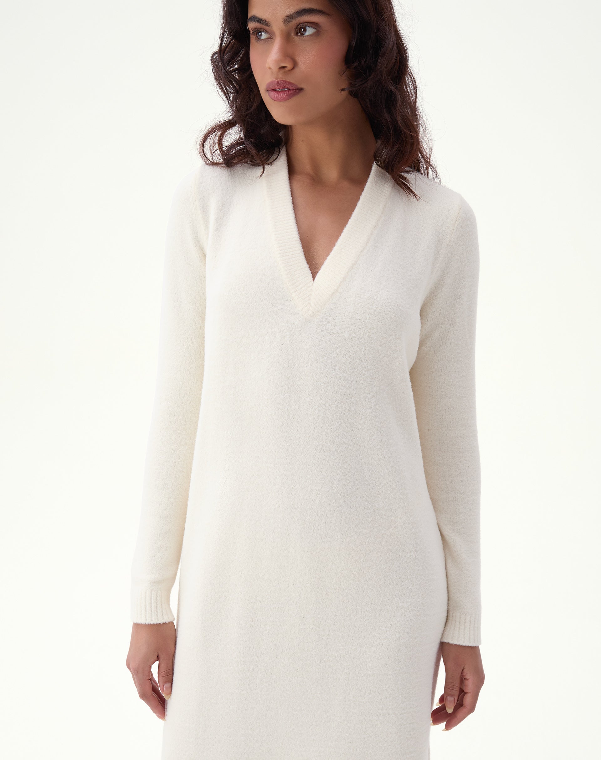 Product image: off-white midi knit dress on white background, full view of fit, V-neckline, and long sleeves - AMARO product