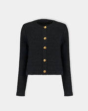 Cardigan tricot preto fotografado em fundo neutro mostrando frente plana e fileira de botões dourados