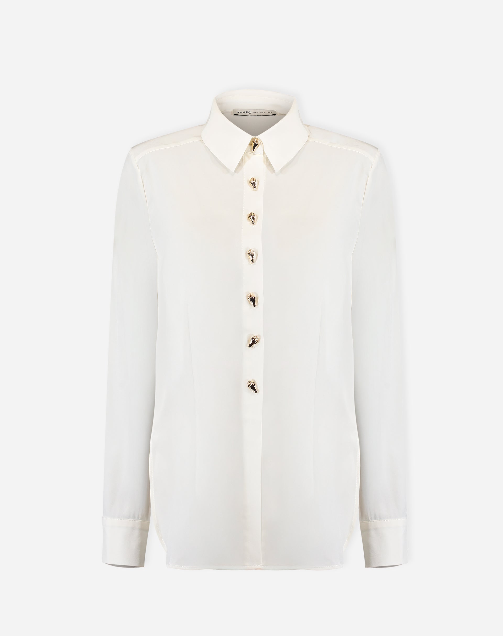 Foto do produto: camisa alongada off-white em fundo branco, vista frontal com botões decorativos e gola pontuda